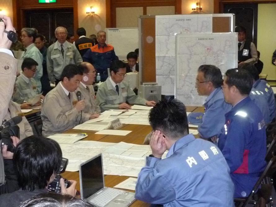 The governor giving information about the situation to a government survey team